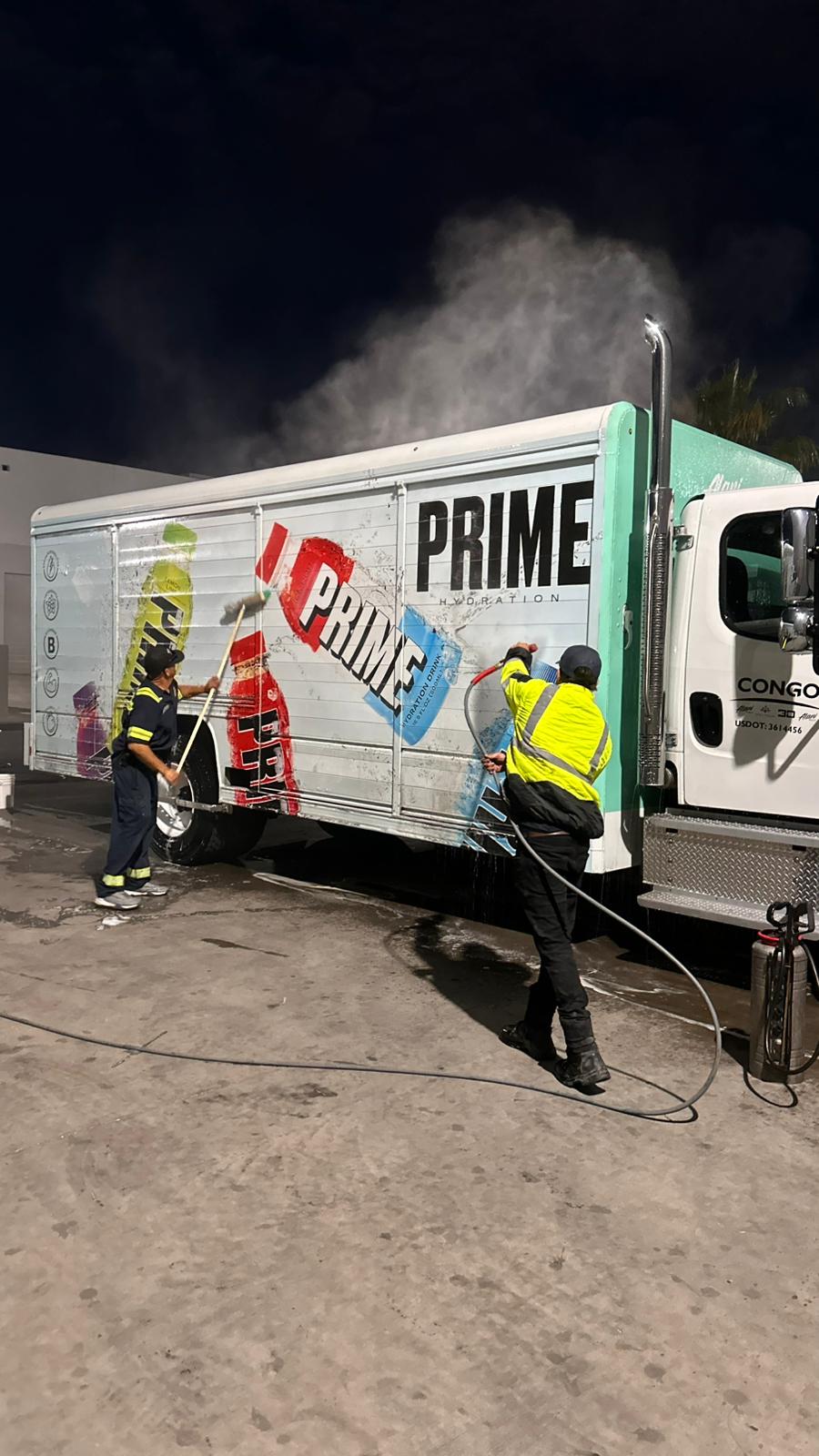 Semi-truck fleet wash service in progress