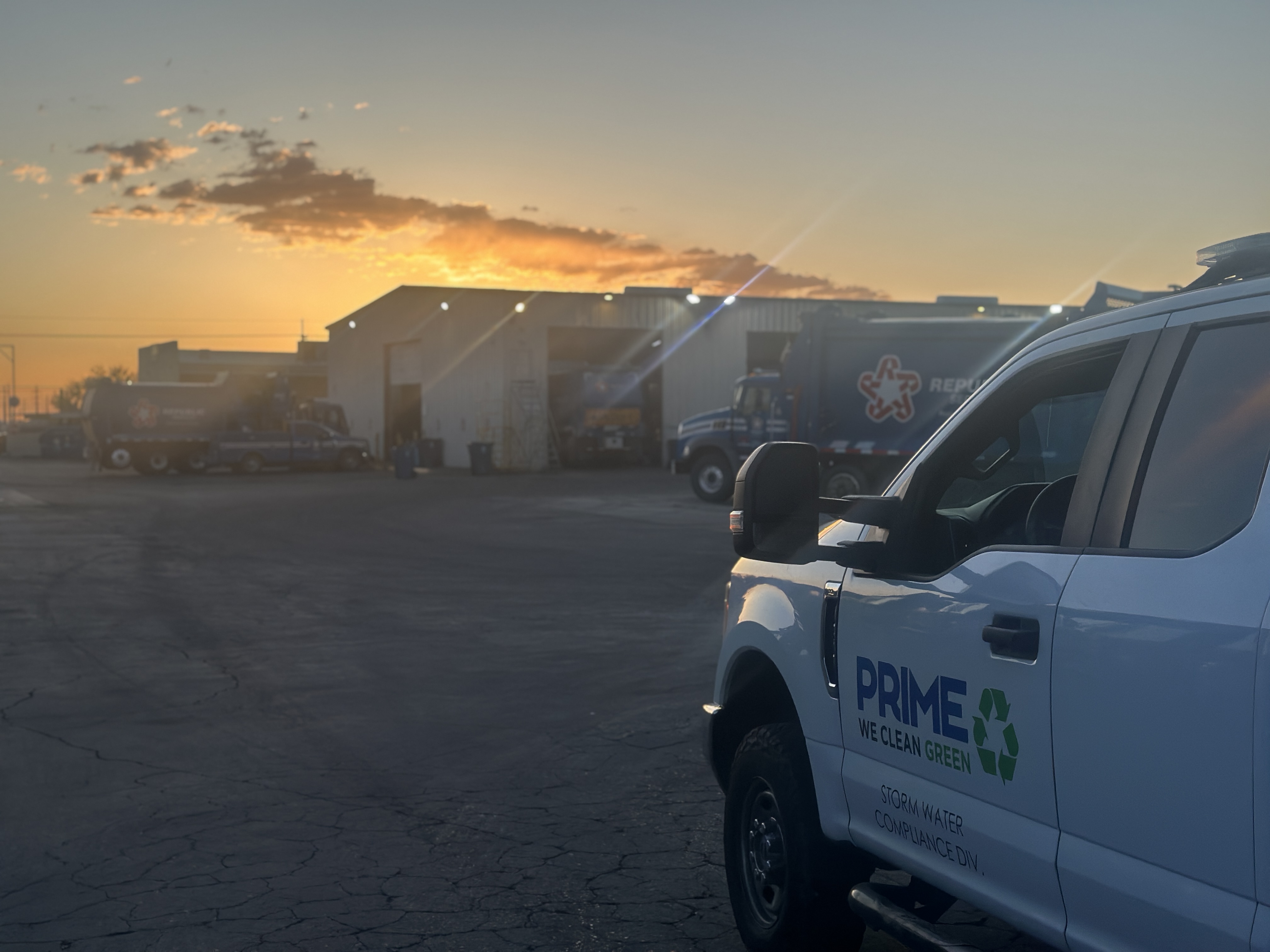 Prime Pressure Clean truck at sunset with Republic Services fleet